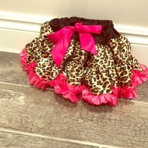 Newborn leopard tutu with pink ruffles and ribbon
